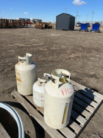 Three expired propane tanks