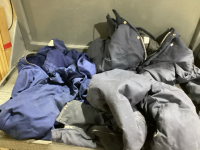 2 PAIR COVERALLS IN LAUNDRY BASKET