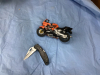 BOX OF MISC COLLECTIBLES - SPOCK COOKIE JAR, METAL DRAGON, DIE CAST MOTORCYCLE, MAXAM JACK KNIFE - 6