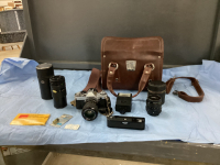 VINTAGE CANON FILM CAMERA W/ (2) EXTRA LENSES, POWER WINDER, FLASH IN A LEATHER BAG