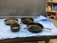 (4) CAST IRON PANS -(1) SMALL POT, (3) SKILLETS