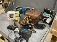 CAMERAS, PHONES, CABLES, SURGE PROTECTORS, CLOCK RADIO,