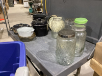 2 LIDDED TOTES WITH HOUSEHOLD ITEMS - LARGE GLASS JARS, CASSEROLE, POTS, PIE PLATE, CAKE PANS, TRIVETS