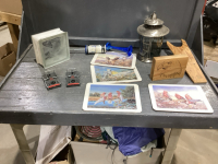 BOX OF CORK PLACEMATS, RAT TRAPS, LANTERN, BOOT JACK, MANUAL AIR HORN