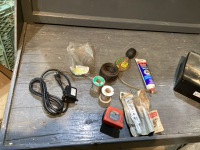BOX OF PUMP, SOLDERING WIRE, HYDROMETER, MECHANICS WIRE, FLARING TOOL, HOCKEY PUCK, TAPE MEASURE