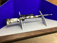 REMINGTON BOLT ACTION 7MM RIFLE - MODEL 700 CAMO W/ 12 POWER BUSHNELL SCOPE.....PAL REQUIRED FOR PURCHASE