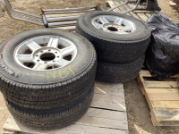 Pallet of 4 dodge 8 bolt, aluminum rims W/hubcaps, bolts and lt245/75r 17 tires