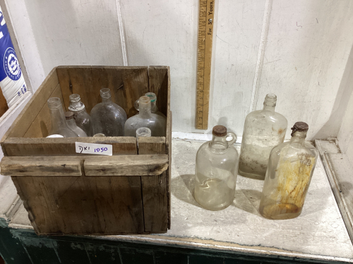 OLD BOTTLES IN OLD WOODEN CRATE