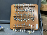 COLLECTOR SPOONS ON WOOD RACK