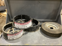 (2) GREY TOTES W/ SINGLE TIRE ON RIM + 3 PROPANE CYLINDER HOLDERS
