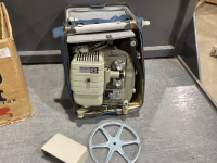 VINTAGE REEL TO REEL PROJECTOR IN OLD CASE