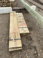Two bundles of treated plank