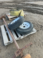 Spring axle and two trailer tires on rims