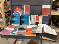 BOX OF OLD FARMING EQUIPMENT AND LIGHT TRUCK TUNE-UP SERVICE MANUALS