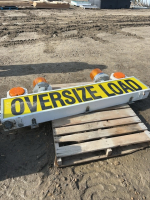 Oversize load, sign, and lights