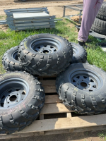 Five ATV tires on rims