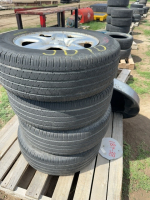 Stack of 17 inch tires on rims