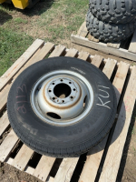 Trailer tire on Steel Dooley grim