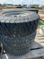 Three tires on rims