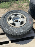 One single winter car tire on rim