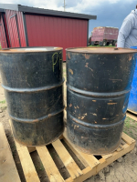 Two empty 45 gallon steel barrels