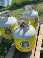 Three re-trade propane tanks and contents