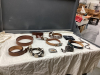 LEATHER AND METAL BELTS, COORS BOLO TIE, CALGARY POLICE RODEO BUCKLE, CALGARY STAMPEDE NECK KERCHIEF
