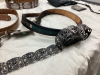 LEATHER AND METAL BELTS, COORS BOLO TIE, CALGARY POLICE RODEO BUCKLE, CALGARY STAMPEDE NECK KERCHIEF - 7