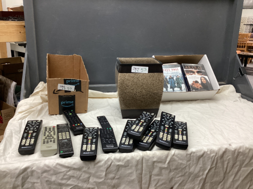 COLLECTION OF REMOTES, A FEW DVD'S AND STONELOOK PLANTER