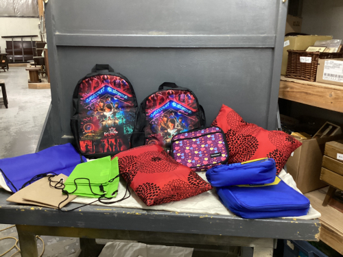 BOX W/ DIY TINTED LIP KIT, (2) RED THROW PILLOWS, (3) NEW INSULATED LUNCH BAGS, (2) NEW "STAR COURT" BACKPACKS