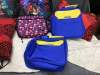 BOX W/ DIY TINTED LIP KIT, (2) RED THROW PILLOWS, (3) NEW INSULATED LUNCH BAGS, (2) NEW "STAR COURT" BACKPACKS - 4