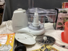 BOX OF MISC KITCHEN ITEMS - HAMILTON BEACH FOOD PROCESSOR, COFFEE PRESS,, SKEWERS, TUPPERWARE, OLD BOOKS - 2