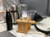 PUNCH BOWL & BOX OF MISC KITCHEN ITEMS - APPLE PEELER, MEAT GRINDER, THERMOS, LAMP, GLASS JAR DISPENSER - 2