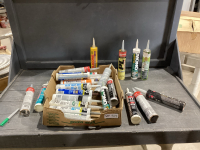 BOX WITH A VARIETY SEALANTS AND ADHESIVES