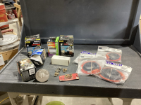 GREEN TOTE W/ ASSORTED LIGHT BULBS, HEAT TAPE + CLAMPS