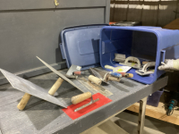 BLUE LIDDED TOTE OF DRY WALL TOOLS