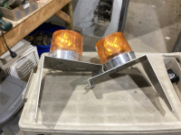 (2) BEACON LIGHTS ON MOUNTING BRACKETS