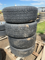 Stack of four tires on on 8 bolt chev rims