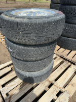Set of four car tires on rims