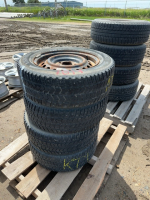 Set of four studded winter tires on steel rim