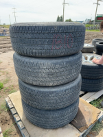 Stack of four tires on AR custom rims