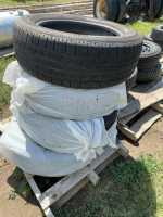 Stack of four Michelin 225/60 R18 car tires