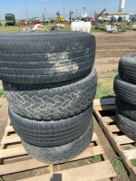 Four car tires ON CHEV RIMS (1998)
