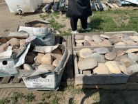 Two pallets of river rock facing
