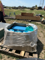 Pallet of water, jugs, and cooler