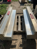 Two aluminum weather guard side boxes