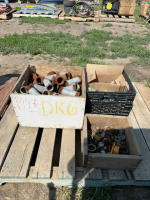 Three boxes of fittings and caps