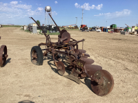 ANTIQUE MCCORMICK DEERING. 4-BOTTOM TRACTOR DRAWN PLOW