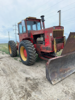 Versatile 700 tractor and dozer blade