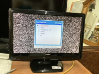 SMALL TOSHIBA 21" FLAT SCREEN TV W/ REMOTE ON STAND